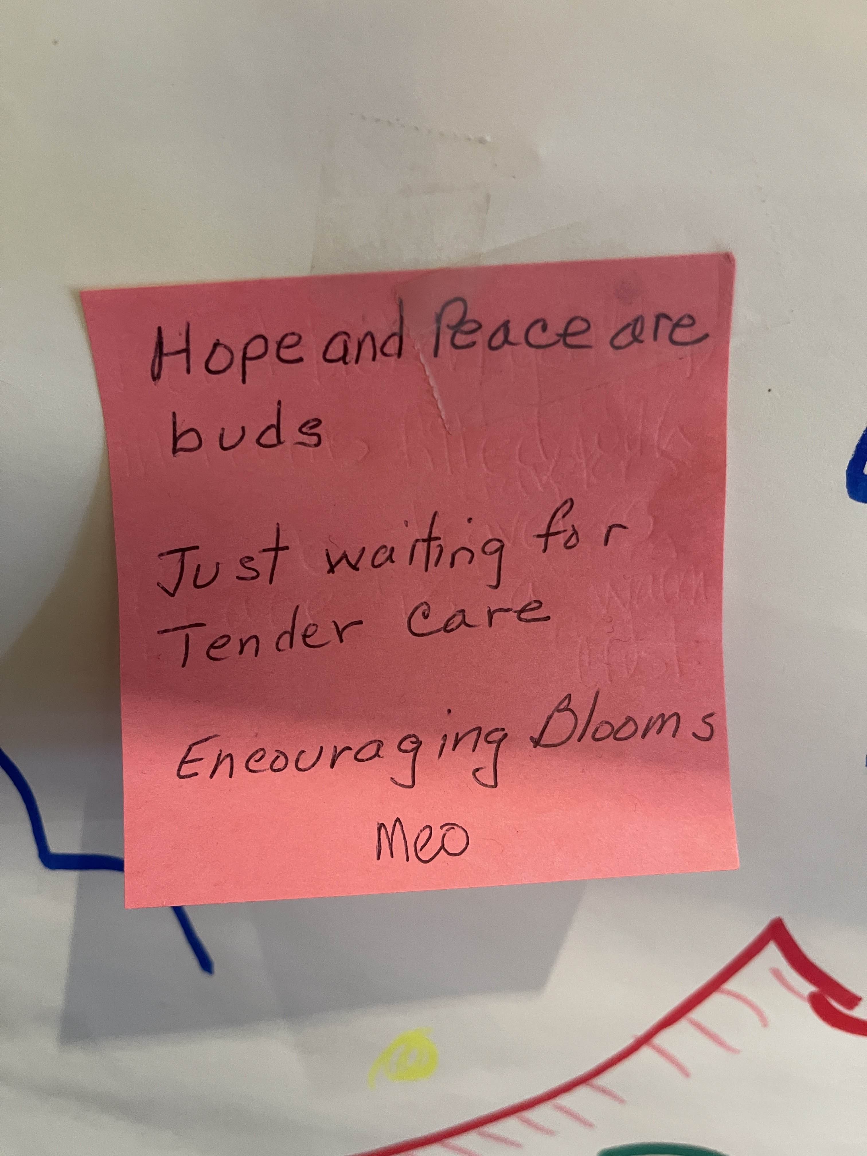 A handwritten haiku on a sticky note